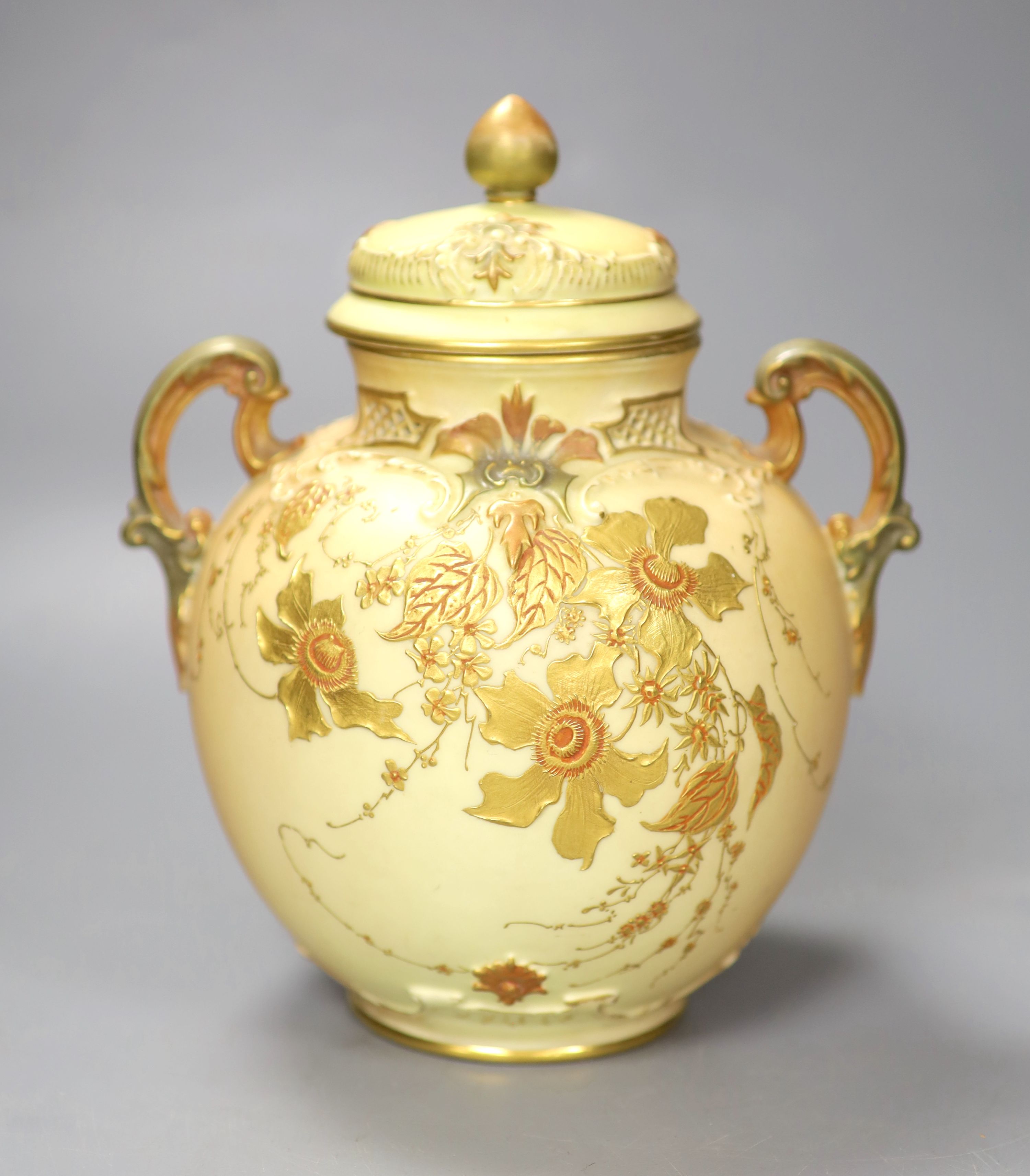 A Royal Worcester two handled ovoid vase moulded and gilded with flowers on a blush ivory ground, shape 1515 date code for 1896, 20cm h